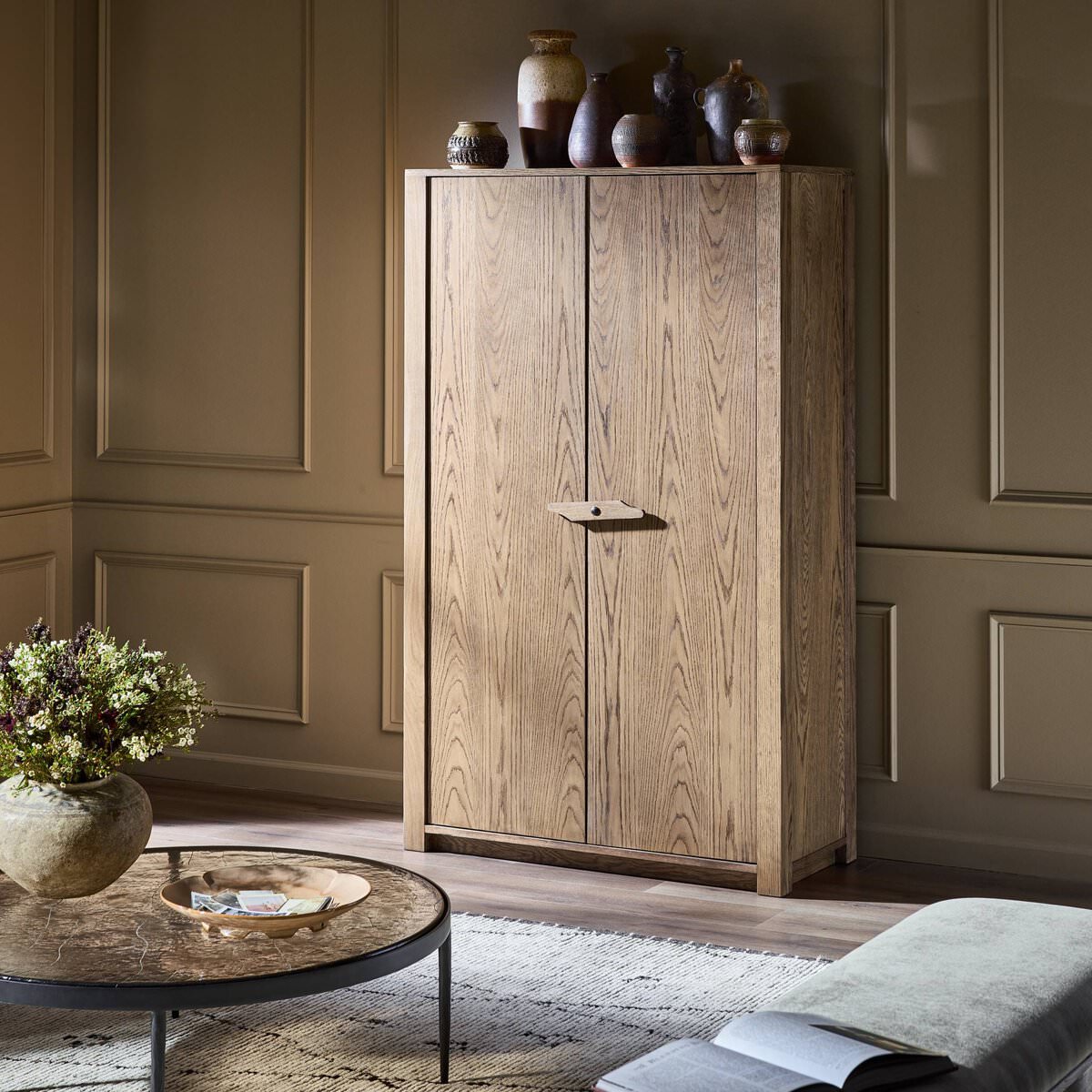 Four Hands Bedford Cabinet in Warm Natural Oak Veneer in a living room at Addison West
