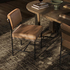 Four Hands Benton Dining Chair in Maestro Camel in dining room at Addison West.