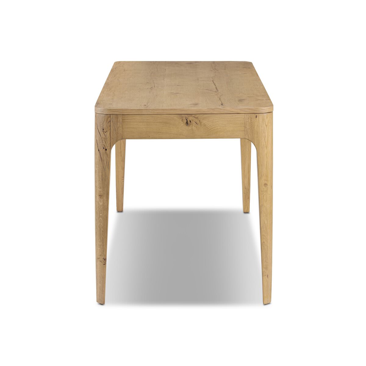 Side of Four Hands Berke Desk in Aged Smoked Oak Veneer on a white background at Addison West