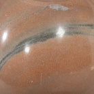 Close up detail of the Four Hands Bibianna Oval Dining Table in Smoked Honey on white background at Addison West.