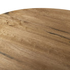 Four Hands Bibianna Oval Dining Table in Smoked Honey on white background at Addison West.