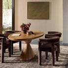 Four Hands Bibianna Oval Dining Table in Smoked Honey in dining room at Addison West.
