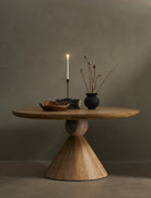Four Hands Bibianna Round 60" Dining Table in Blush Marble against a beige background