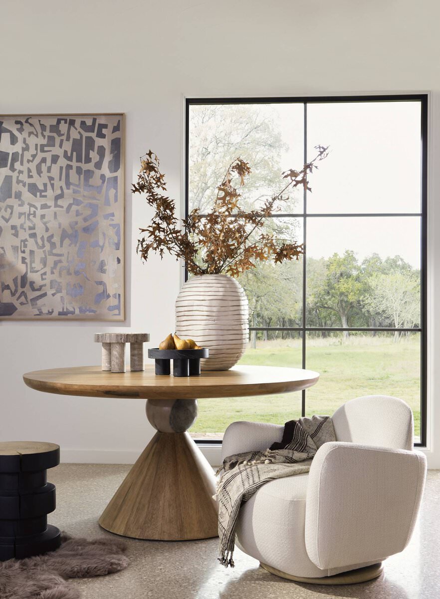 Four Hands Bibianna Round 60" Dining Table in Blush Marble in a modern dining room