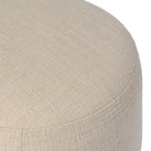 Close up of Four Hands Bilbury Ottoman in Saxon Sand on a white background at Addison West