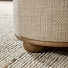 Close up of Four Hands Bilbury Ottoman in Saxon Sand on a white background at Addison West