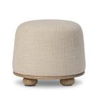 Four Hands Bilbury Ottoman in Saxon Sand on a white background at Addison West