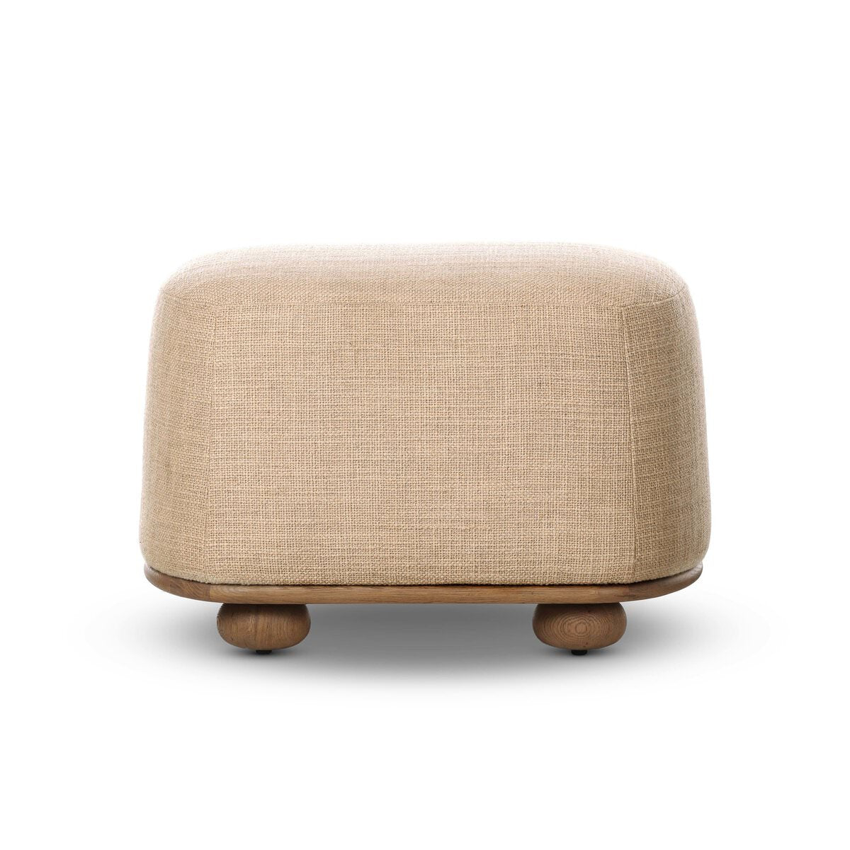 Four Hands Bilbury Oval Ottoman in Saxon Sand on a white background at Addison West