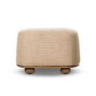 Four Hands Bilbury Oval Ottoman in Saxon Sand on a white background at Addison West