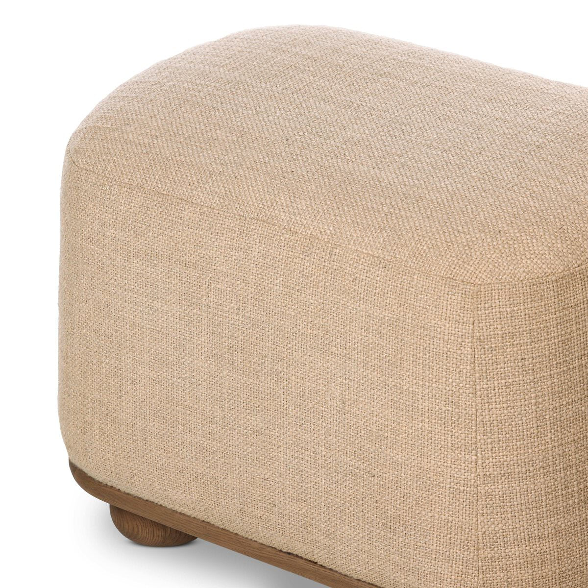 Close up of Four Hands Bilbury Oval Ottoman in Saxon Sand on a white background at Addison West