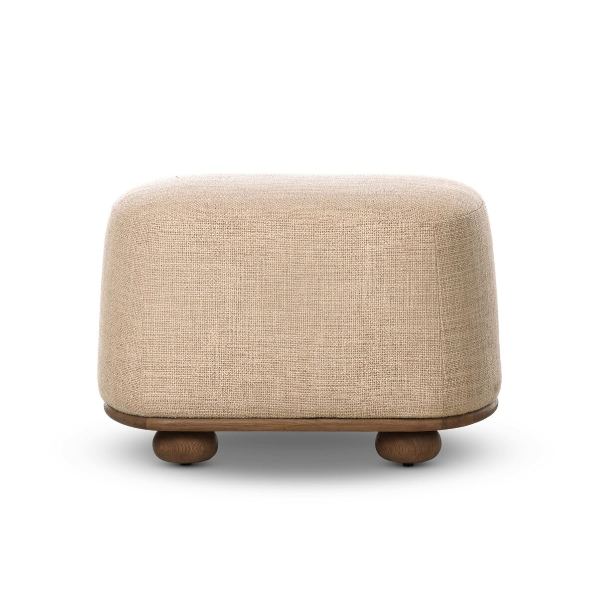 Four Hands Bilbury Oval Ottoman in Saxon Sand on a white background at Addison West