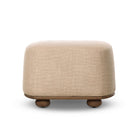 Four Hands Bilbury Oval Ottoman in Saxon Sand on a white background at Addison West