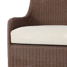 Close up of Four Hands Blaire Outdoor Swivel Chair in Tanned Weave on a white background at Addison West