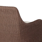 Close up of Four Hands Blaire Outdoor Swivel Chair in Tanned Weave on a white background at Addison West
