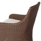 Close up of Four Hands Blaire Outdoor Swivel Chair in Tanned Weave on a white background at Addison West