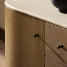 Close up of Four Hands Boa Media Console in Sandy Mindi in a living room at Addison West