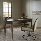 Four Hands Bowfront Desk in Drifted Oak Veneer in an office at Addison West