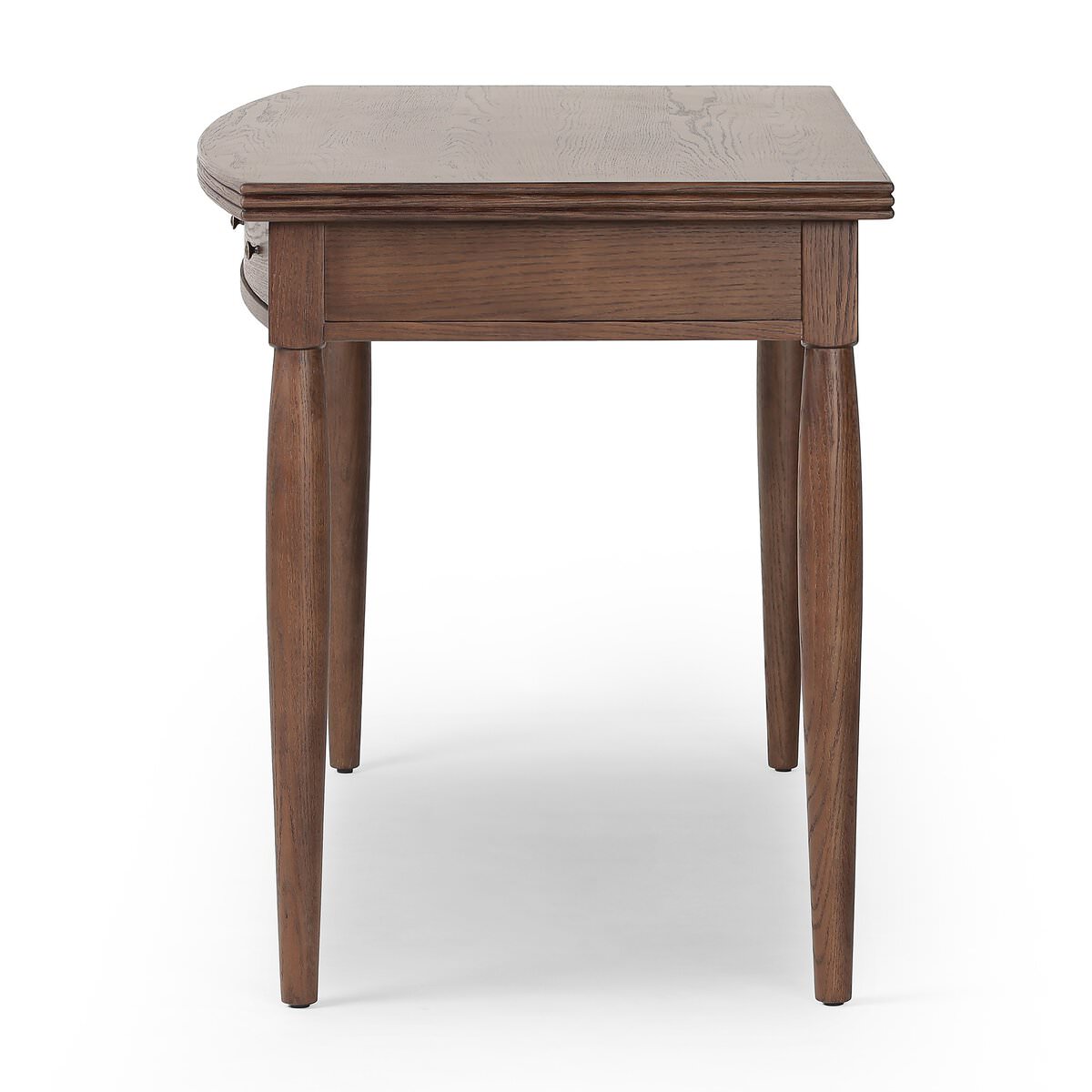 Side of Four Hands Bowfront Desk in Drifted Oak Veneer on a white background at Addison West