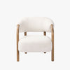 Four Hands Brodie Chair In Sheldon Ivory with sheepskin like upholstery and wood frame on a white background