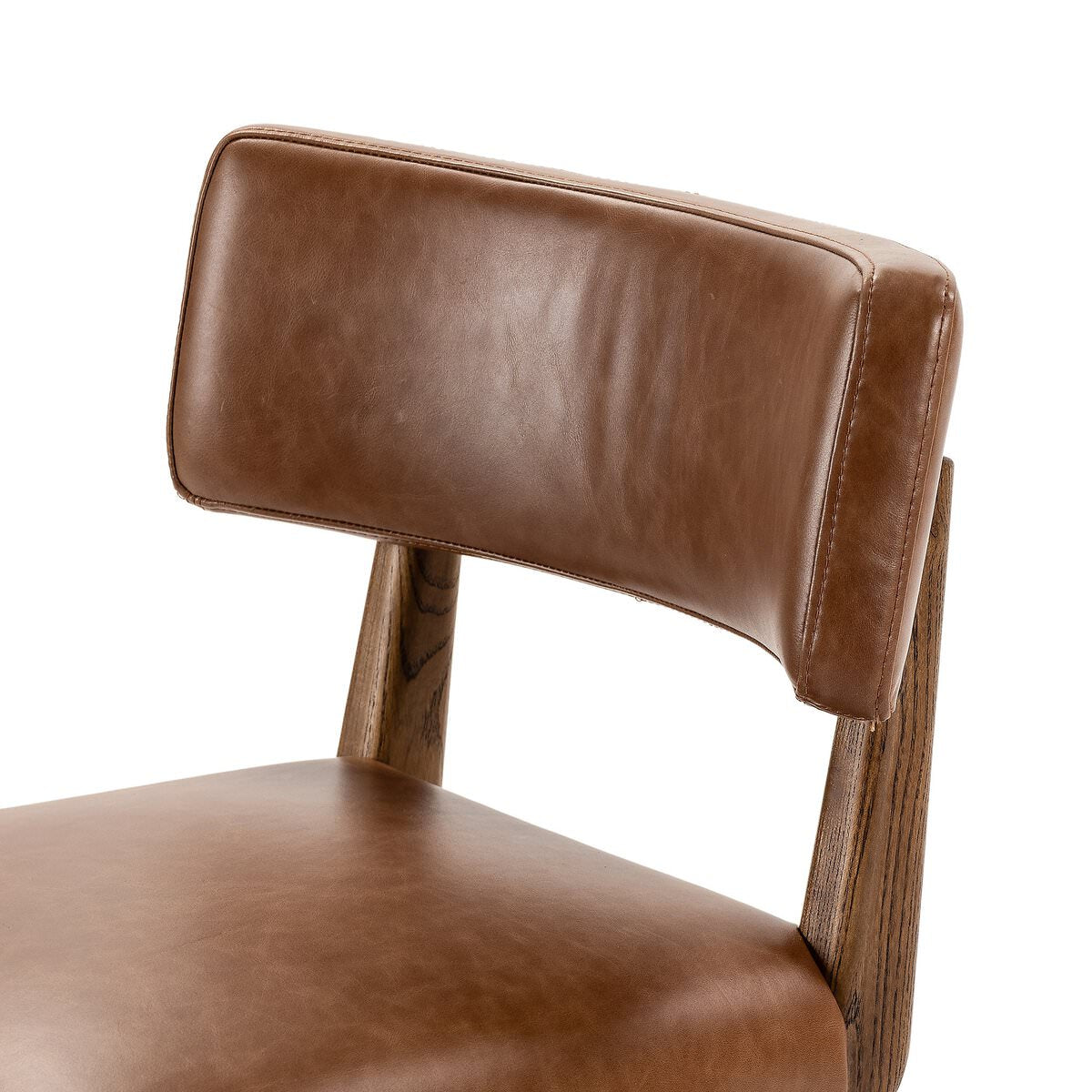 Close up of Four Hands Cardell Swivel Counter Stool in Sonoma Chestnut on a white background at Addison West