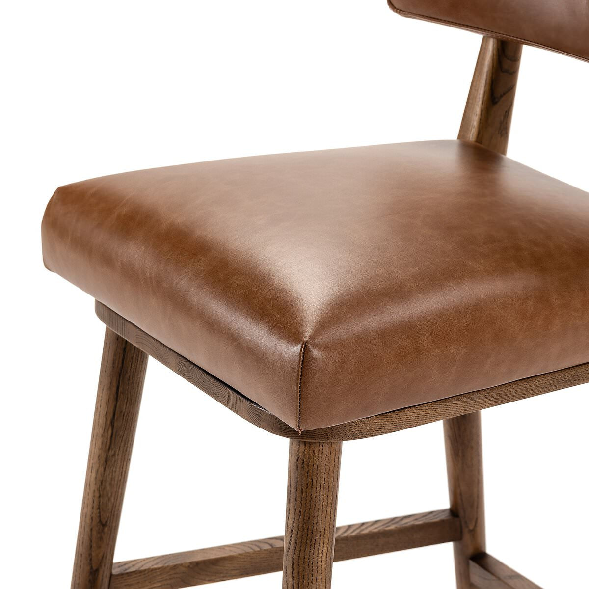 Close up of Four Hands Cardell Swivel Counter Stool in Sonoma Chestnut on a white background at Addison West