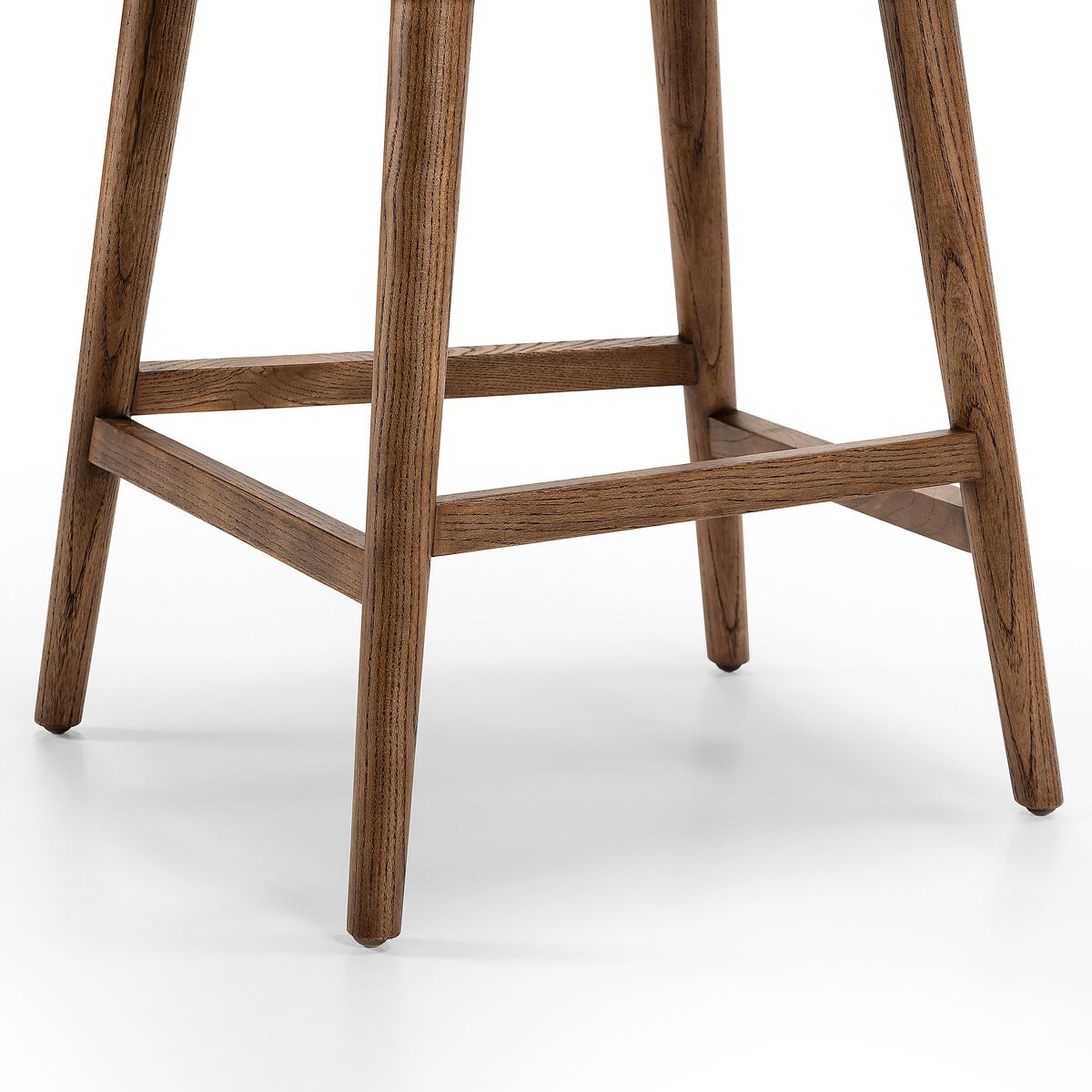Close up of Four Hands Cardell Swivel Counter Stool in Sonoma Chestnut on a white background at Addison West
