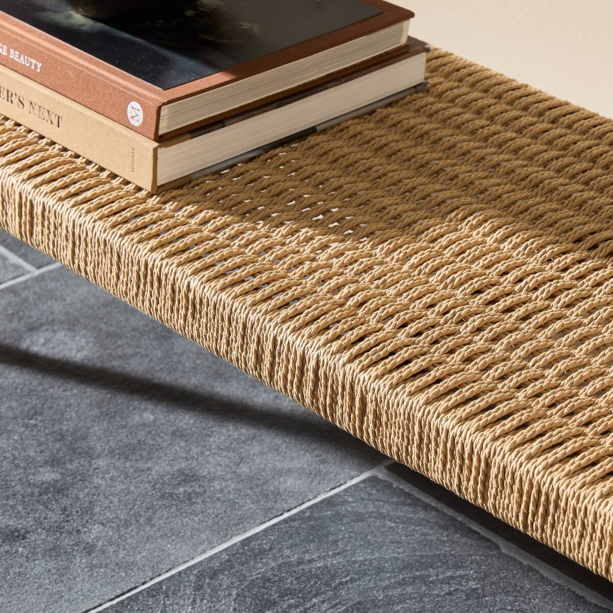 Close up of Four Hands Carmelo Console Table in Tempered Glass in a living room at Addison West