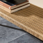 Close up of Four Hands Carmelo Console Table in Tempered Glass in a living room at Addison West