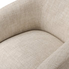 Close up of Four Hands Channing Swivel Chair in Yuma Cream on a white background at Addison West