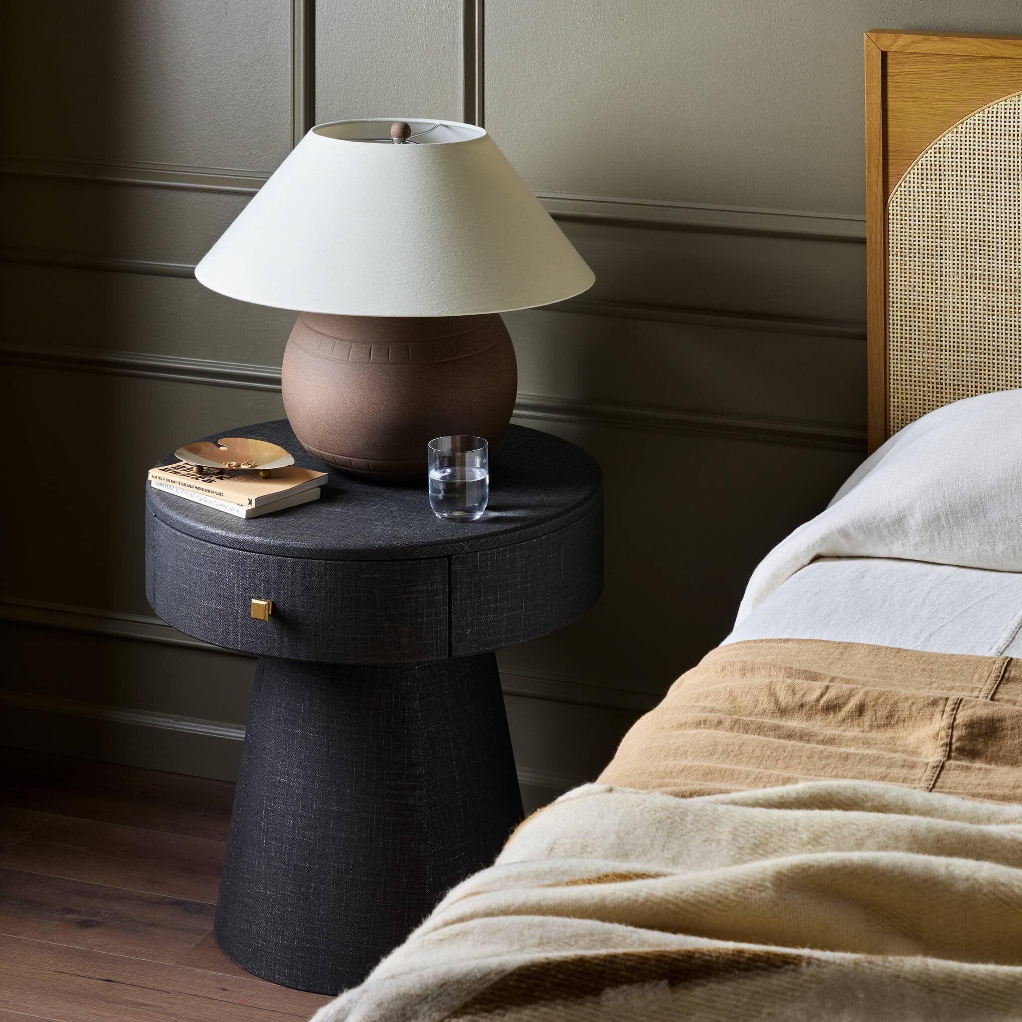 Four Hands Chiro Nightstand in Black Linen in bedroom at Addison West.