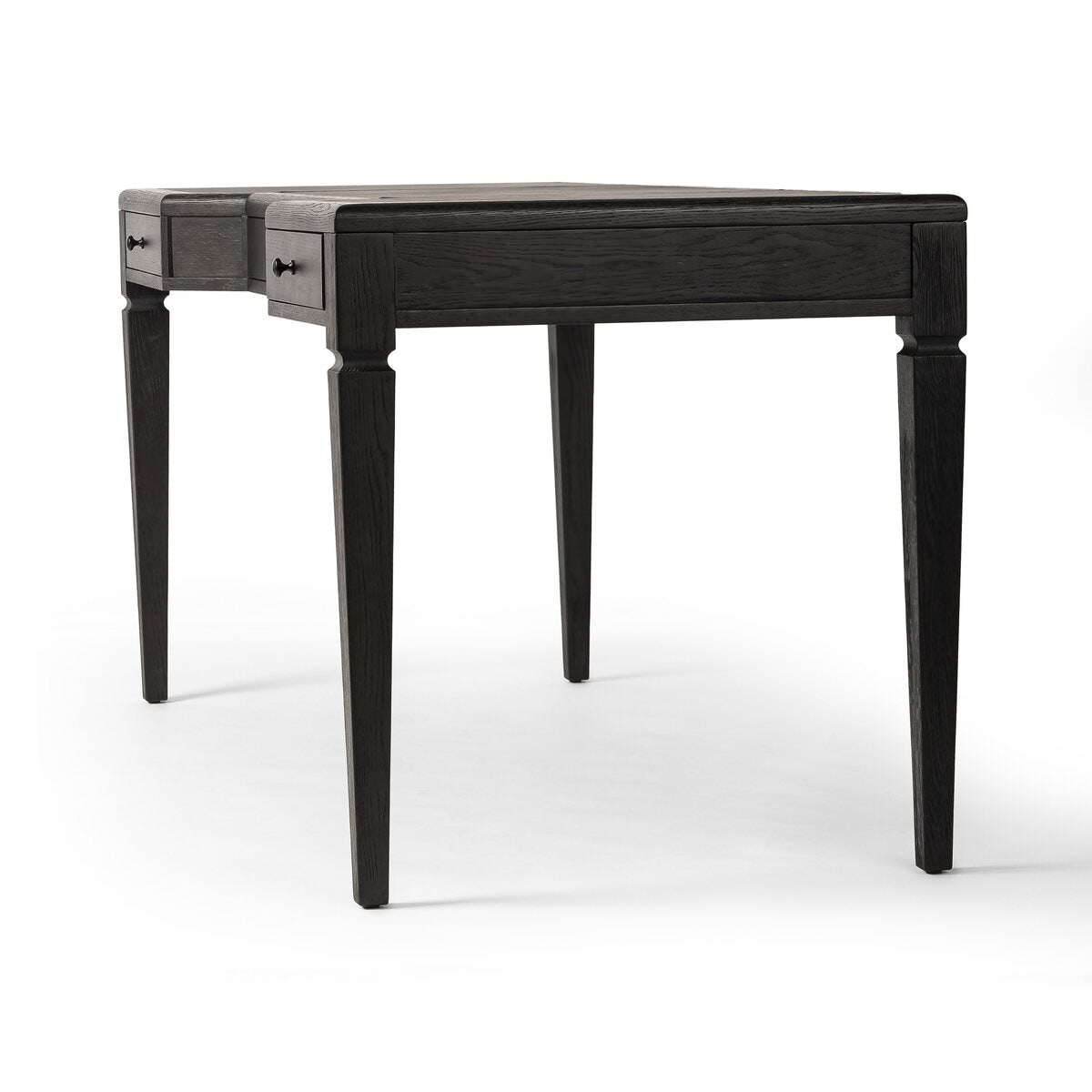 Four Hands Claude Desk in Distressed Black Oak Veneer on a white background at Addison West