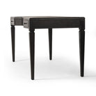 Four Hands Claude Desk in Distressed Black Oak Veneer on a white background at Addison West
