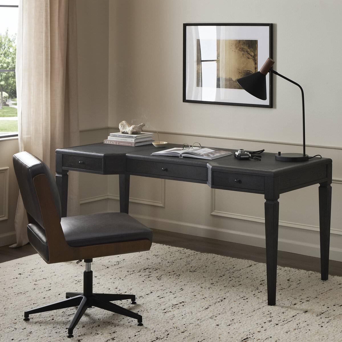 Four Hands Claude Desk in Distressed Black Oak Veneer in an office at Addison West