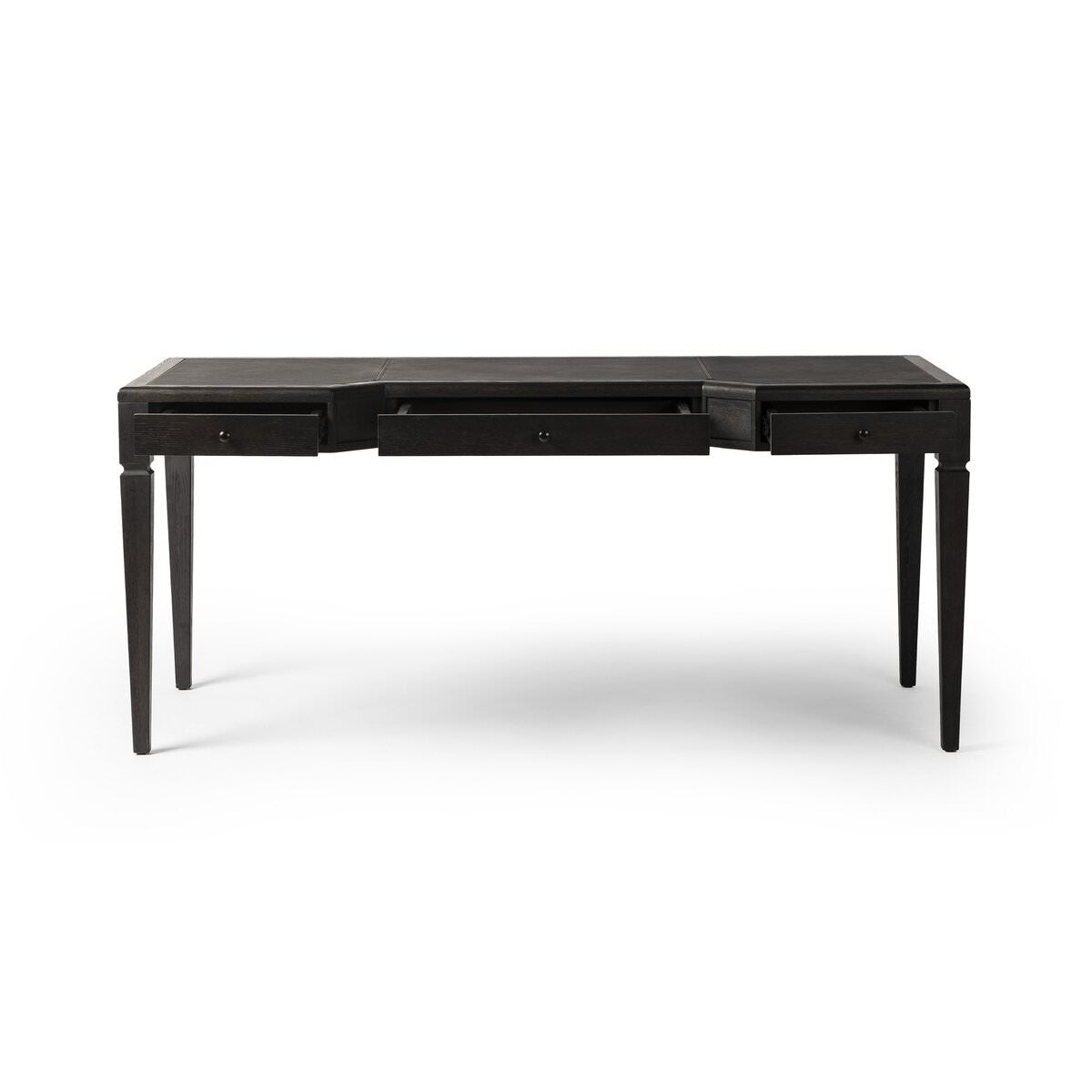 Four Hands Claude Desk in Distressed Black Oak Veneer on a white background at Addison West