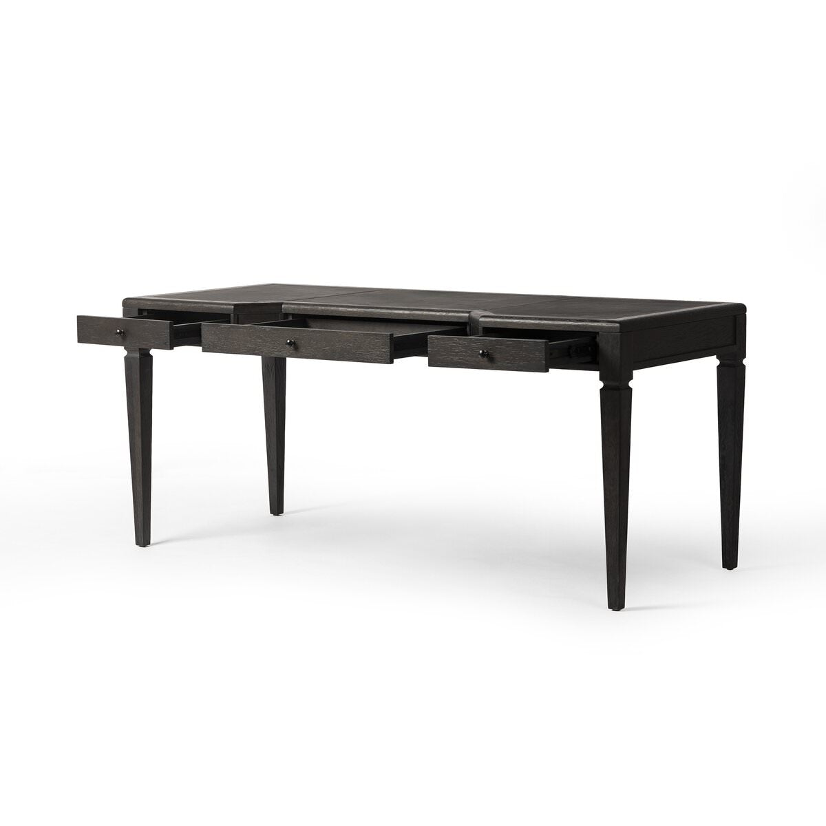 Four Hands Claude Desk in Distressed Black Oak Veneer on a white background at Addison West