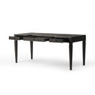 Four Hands Claude Desk in Distressed Black Oak Veneer on a white background at Addison West