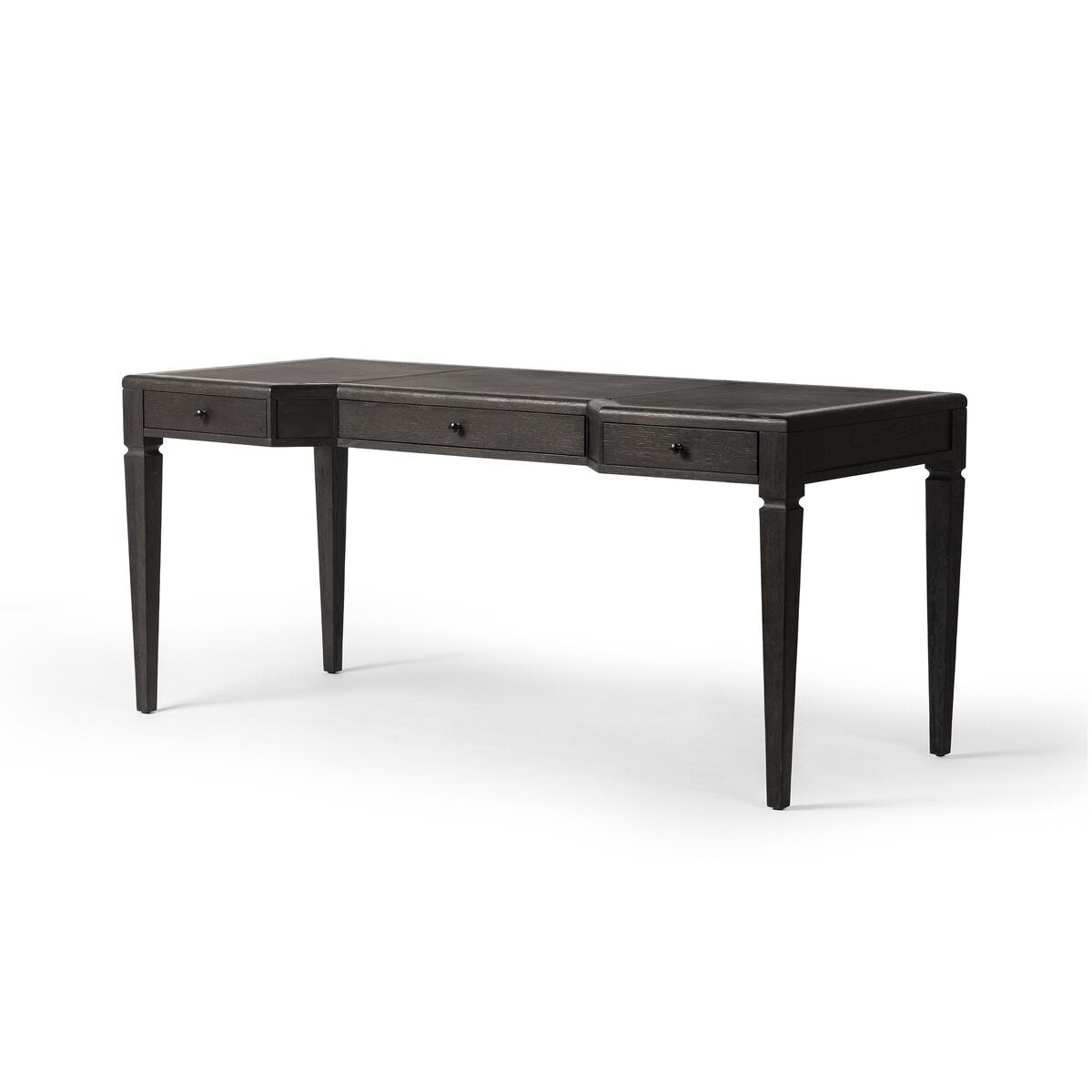 Four Hands Claude Desk in Distressed Black Oak Veneer on a white background at Addison West