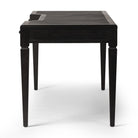 Side of Four Hands Claude Desk in Distressed Black Oak Veneer on a white background at Addison West