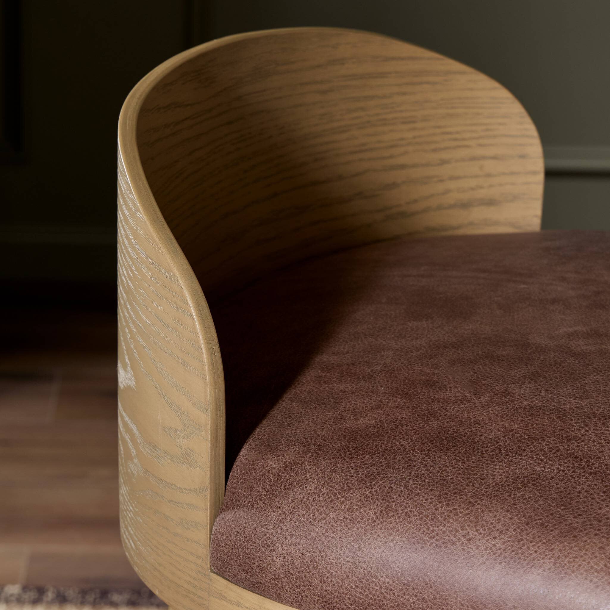 Close up of Four Hands Cloris Swivel Counter Stool in Palermo Cigar in dining room at Addison West.