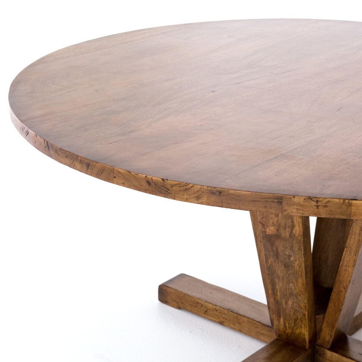 Close up of Four Hands Cobain Round 60" Dining Table in Reclaimed Mango on a white background