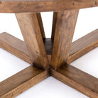 Close up of Four Hands Cobain Round 60" Dining Table in Reclaimed Mango on a white background