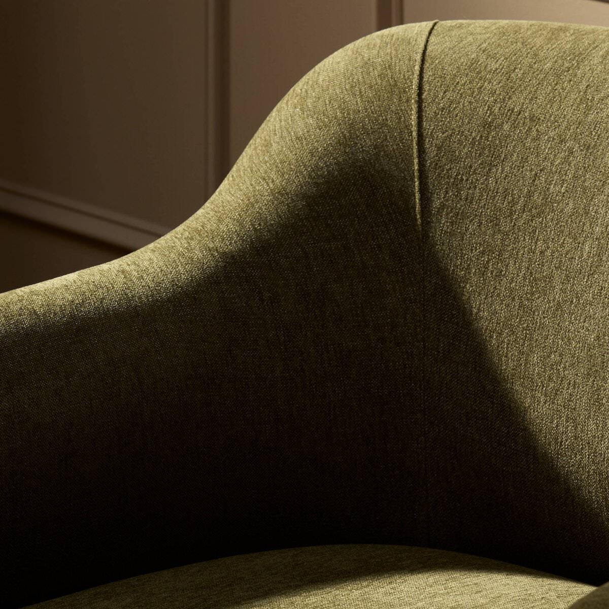 Close up of Four Hands Colston Chair in Sutton Olive in a living room at Addison West