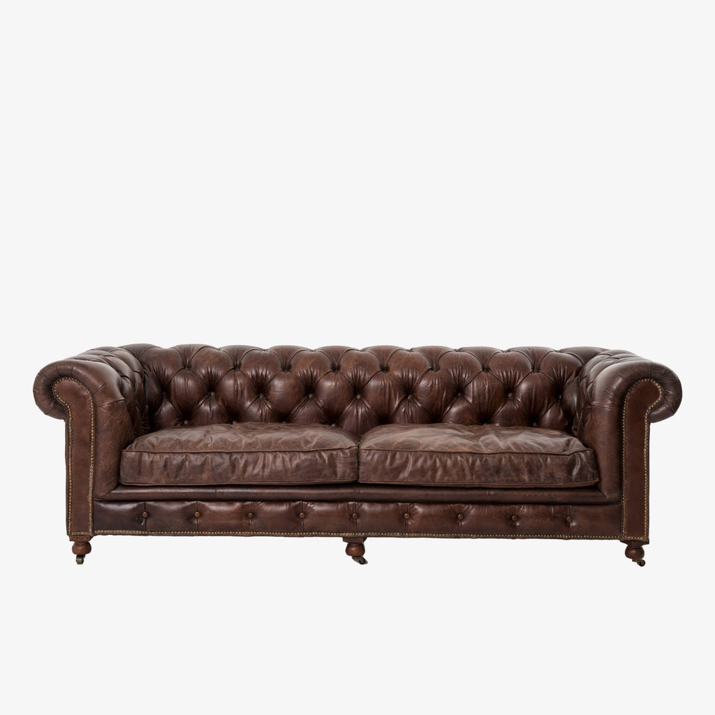 Four Hands brand chesterfield style Conrad Sofa In Cigar on a white backrgound