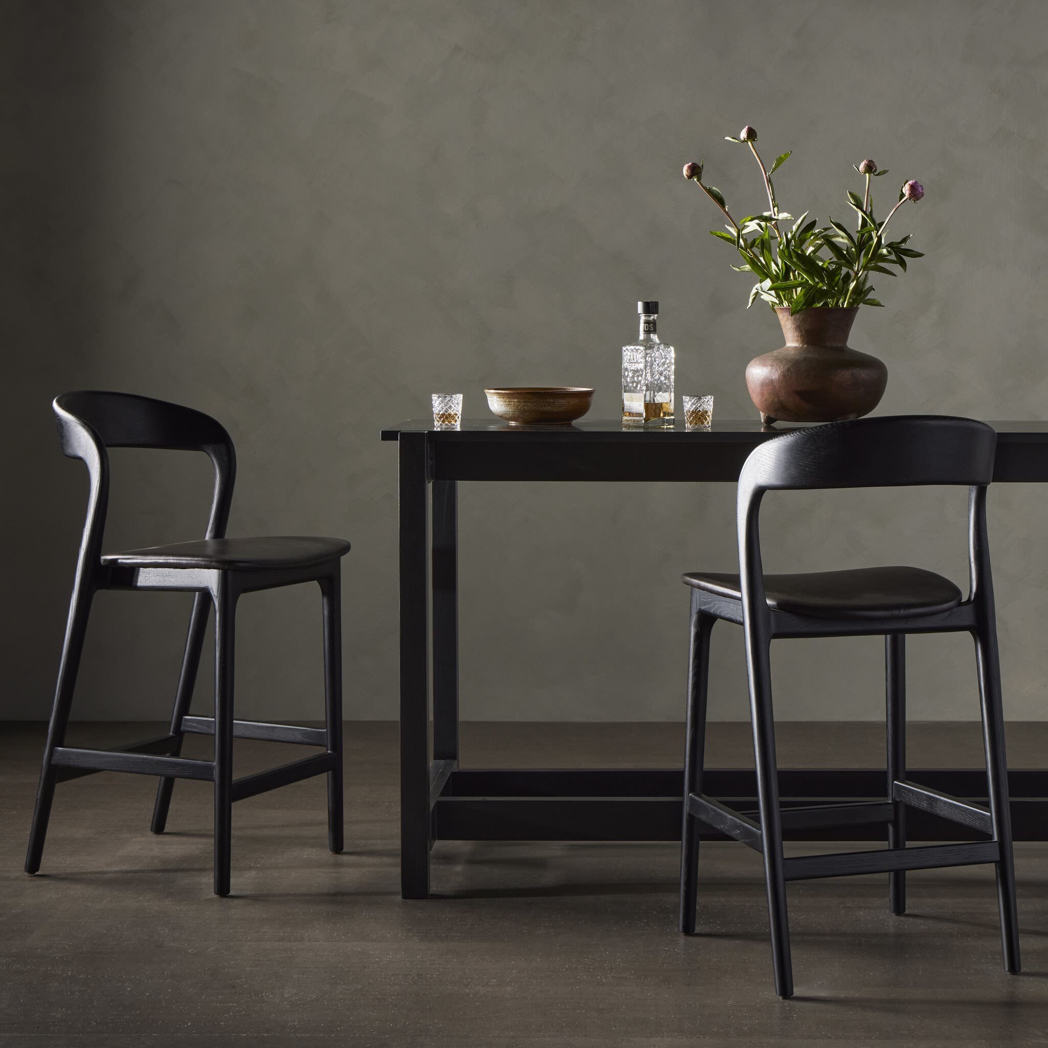 Four Hands Counter Stool in Sonoma Black in a grey dining room at Addison West
