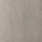 Close up of Four Hands Cove Dining Chair With Casters in Heather Twill Stone on a white background