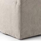 Close up of Four Hands Cove Dining Chair With Casters in Heather Twill Stone on a white background