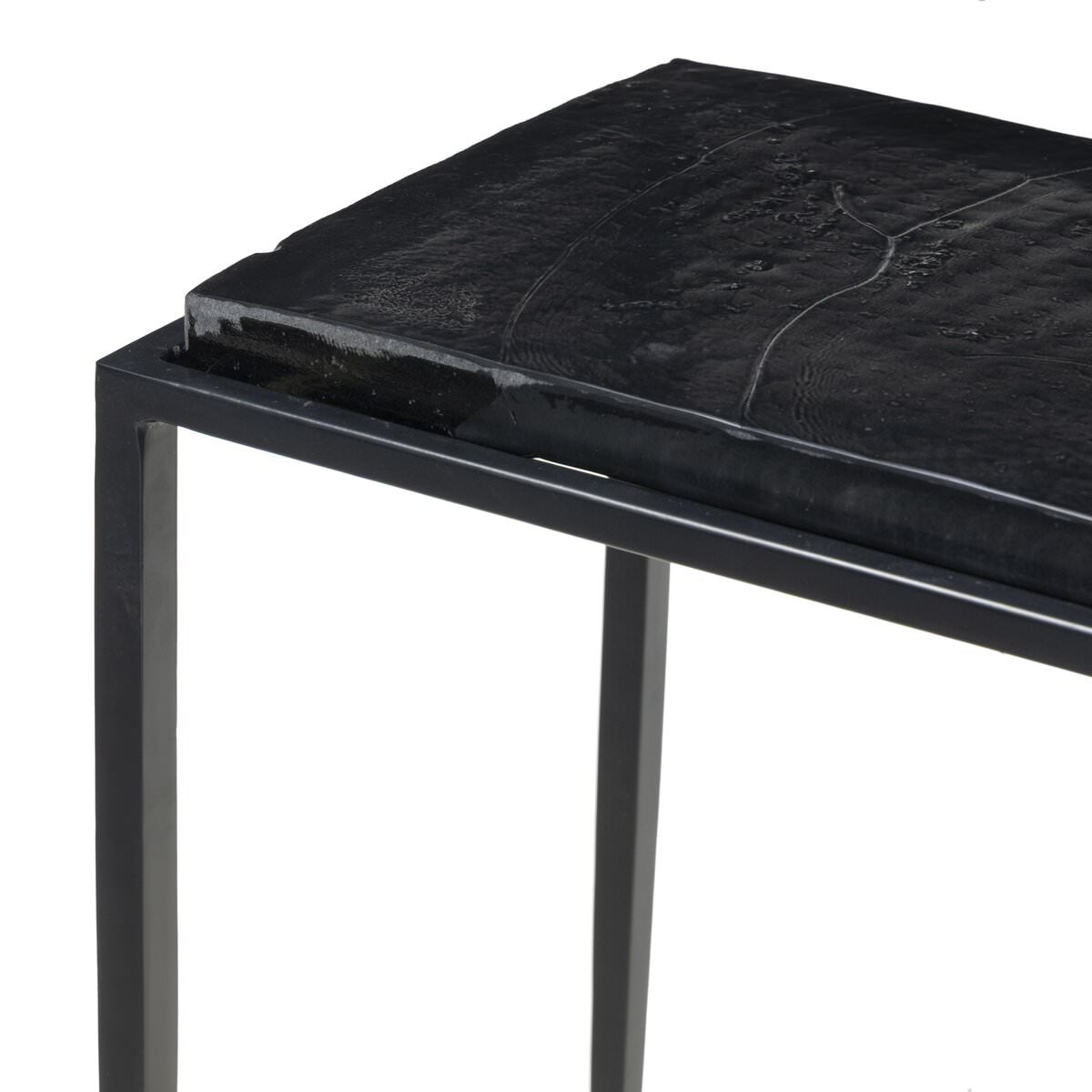 Close up of Four Hands Dalston Cast Glass Console Table in Smoked Black Cast Glass on a white background at Addison West