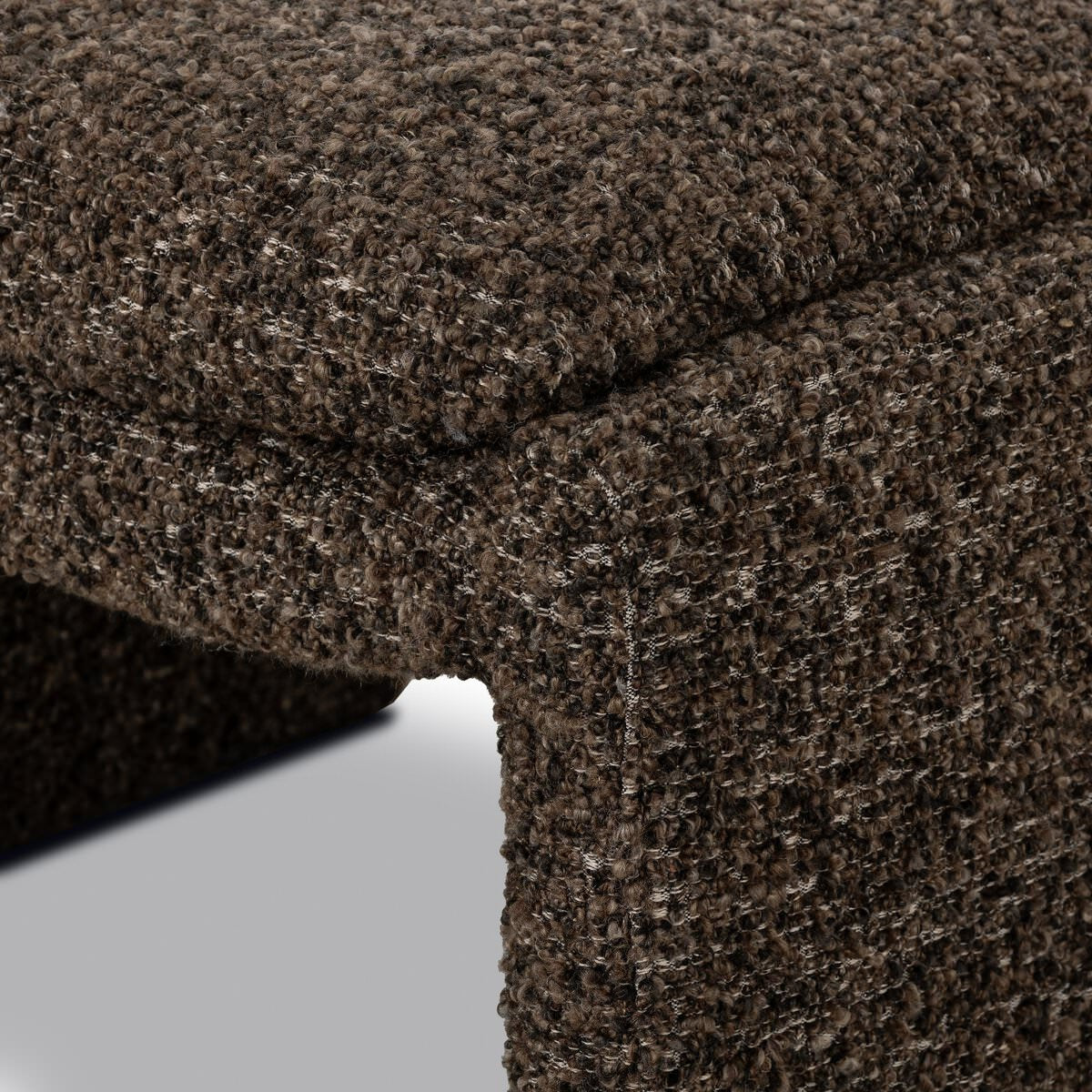 Close up of Four Hands Daniel Ottoman in Ivan Granite on a white background at Addison West