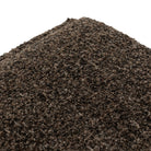 Close up of Four Hands Daniel Ottoman in Ivan Granite on a white background at Addison West