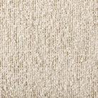 Close up of Four Hands Daniel Ottoman in Ivan Sand on a white background at Addison West